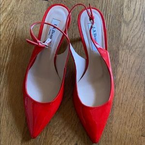 L.K. Bennett Patent Red Pumps